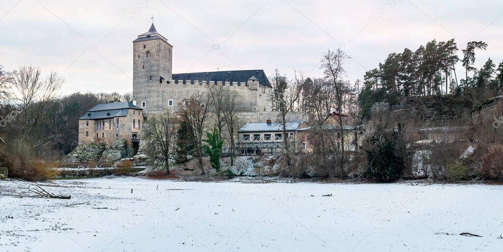 Castle Kost. View over frozen pond to historically castle Kost, Czech Republic.