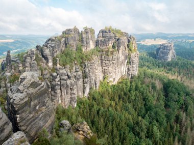 Panoramic view of sharp Schrammsteine and landscape in Saxon Switzerland park on hiking trail Germany