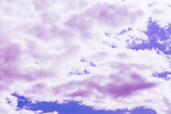 Purple clouds with beautiful blue sky,on the heaven.Amazing nature background.Toned.