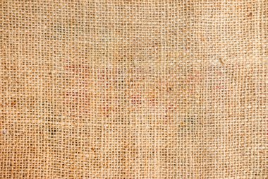 Arka plan için doğal çuval bezi desenli. Jute hessian çuval bez bej krem kahverengi arkaplan dokuma bezi bezi bez rengi kumaş bez bez bez bez bez bez kumaş desenli. Boş uzay.