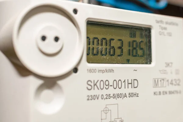 Funny Smart electric power meter counter measuring power usage.Close-up of modern smart grid residential digital power supply meter.Indoors shot.Selective focus.