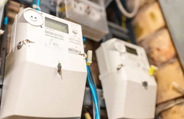 Two smart electric power meter counter measuring power usage.Close-up of modern smart grid residential digital power supply meter.Indoors shot.Selective focus.