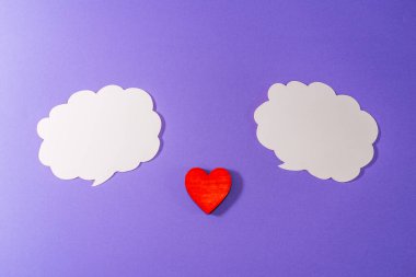 White clouds,heart for Valentine's day concept.Communication red heart between two clouds. Purple,veri peri background.Place for your text. Copy space.