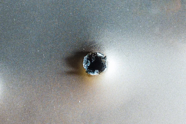 Bullet Hole Silver Metal Selective Focus Closeup Copy Space — Stock Fotó
