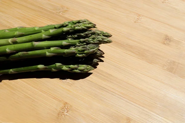 Fresh green asparagus on green background. Fresh green asparagus on green background