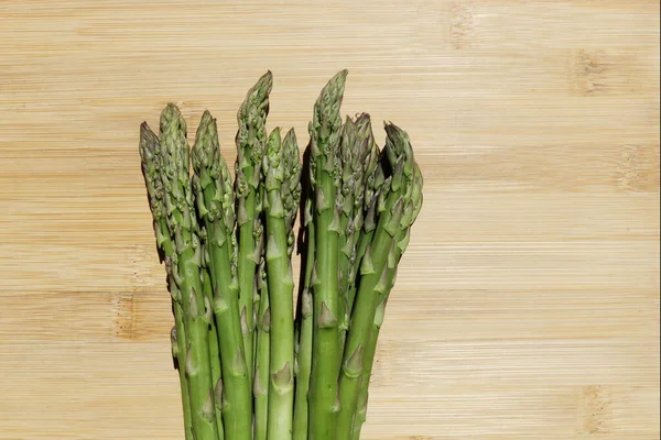 Fresh green asparagus on green background. Fresh green asparagus on green background