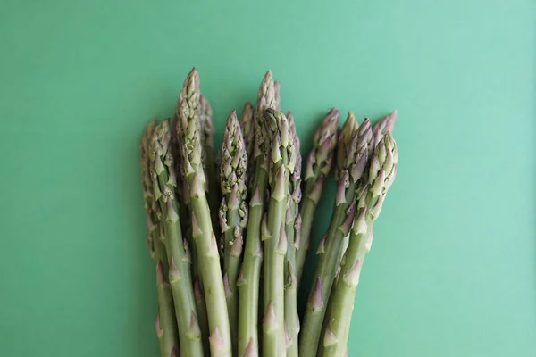 Fresh green asparagus on green background. Fresh green asparagus on green background