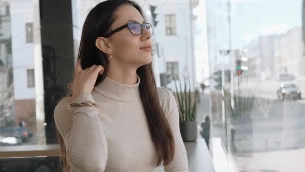 Young Elegant Woman Eyeglasses Watching City Life Sitting Big Window — Wideo stockowe