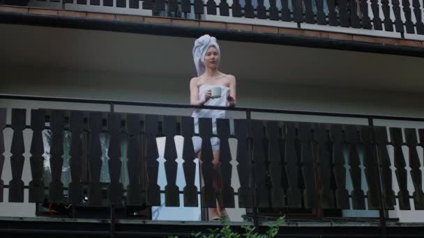 Caucasian Young Woman Covered White Towel Drinking Coffee Wooden Balcony — Stockvideo
