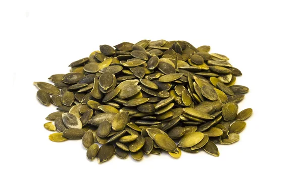 Pumpkin seeds on a white background . — Stock Photo, Image