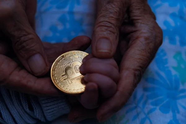 Captures Moment Grandmother Giving Hand Hand Bitcoin Token Newborn Son Royalty Free Stock Photos