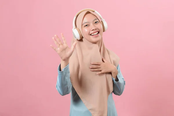 Cheerful Asian Muslim Girl Listening Music Wireless Headphones Dancing Pink — Stock Photo, Image