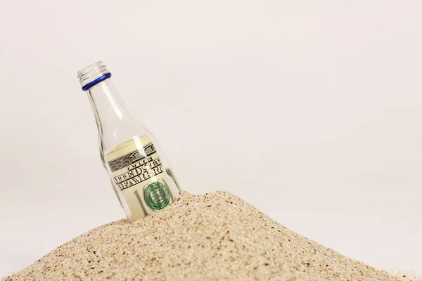 Message in a bottle on sand on white backgound — Stock Photo, Image