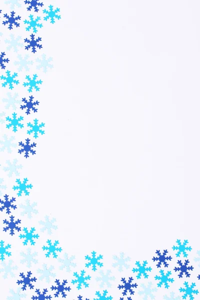 Dark blue and turquoise snowflakes on white background