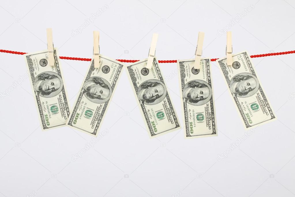 Money american hundred dollar bills hanging on laundry line