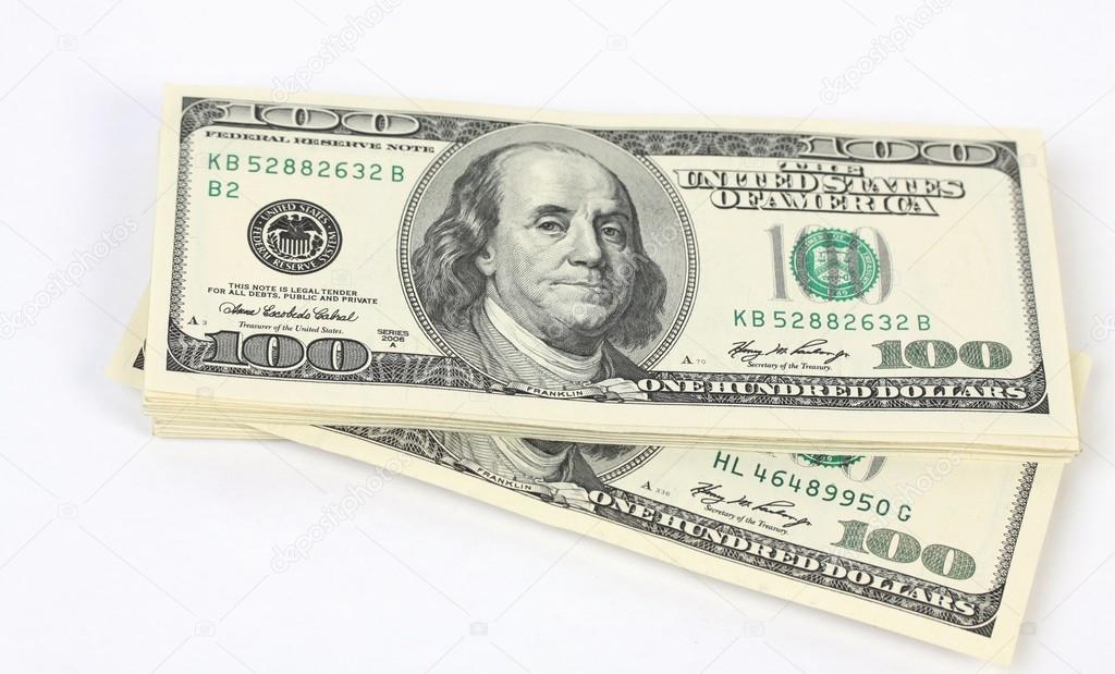 Stack of money american hundred dollar bills on white background