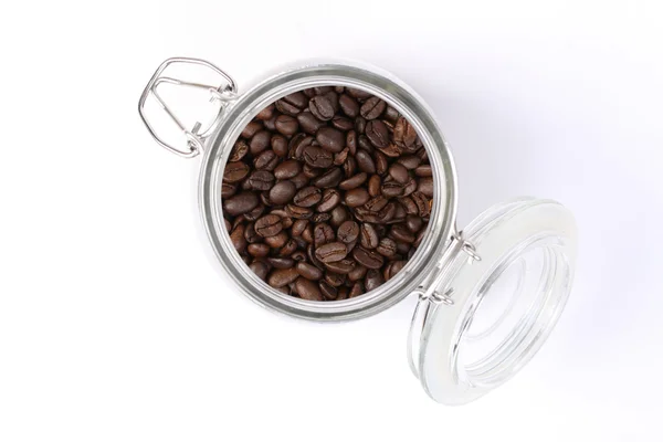 Coffee beans in glass jar standing on white background — Stock Photo, Image