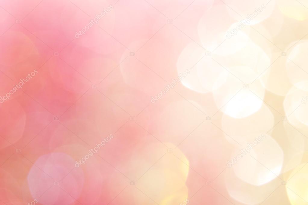 Gold and pink abstract bokeh lights, defocused background