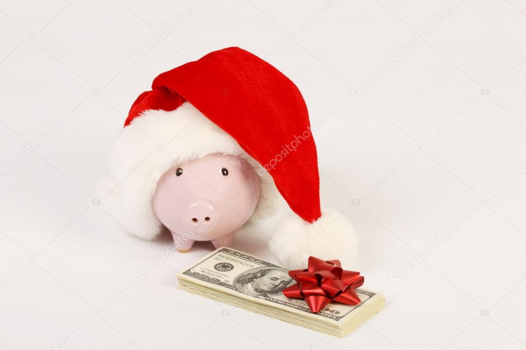 Pink Piggy Bank With Santa Claus Hat And Stack Of Money