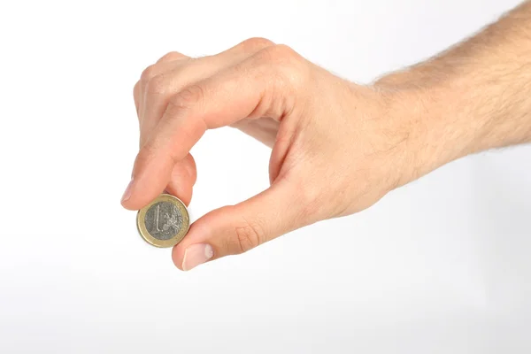 Ręka mężczyzny gospodarstwa jeden euro moneta na białym tle — Zdjęcie stockowe