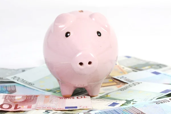 Piggy bank style money box on euros banknote — Stock Photo, Image