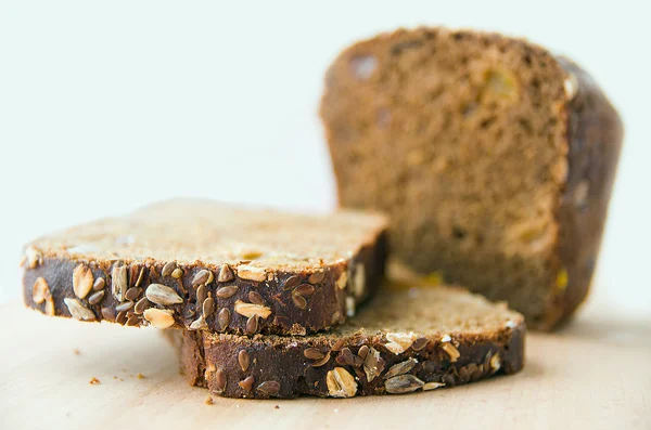 Sliced bread on the kitchen blackboard — Stock Photo, Image