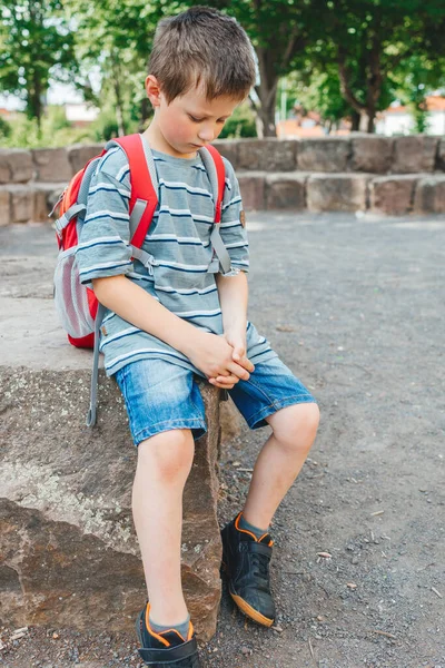 Sad Schoolboy Sits School Yard Backpack His Back Childrens Problems — Stock Photo, Image
