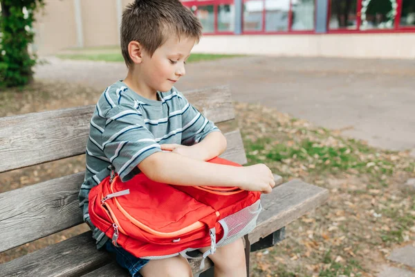 Boy Sits Bench School Yard Takes Out Lunch Box School — Stock Photo, Image