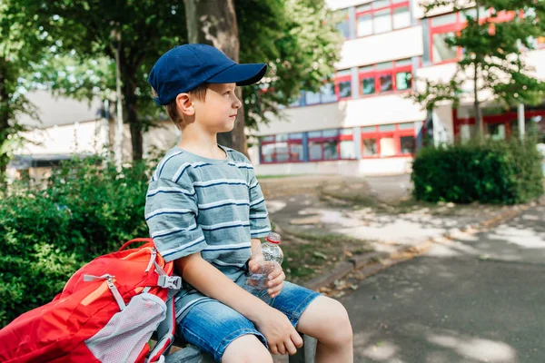 Schoolboy Sits Bench School Yard Drinks Water Bottle Water Balance — Fotografia de Stock