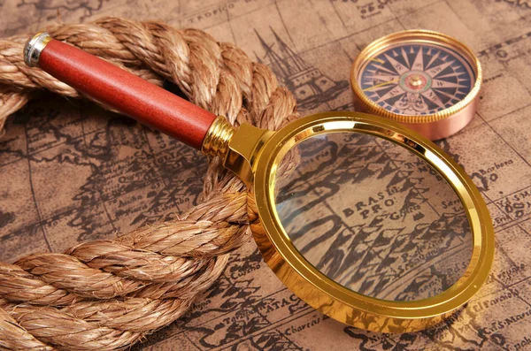 Ancient map and magnifying glass — Stock Photo, Image
