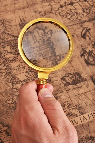 Ancient map and magnifying glass — Stock Photo, Image