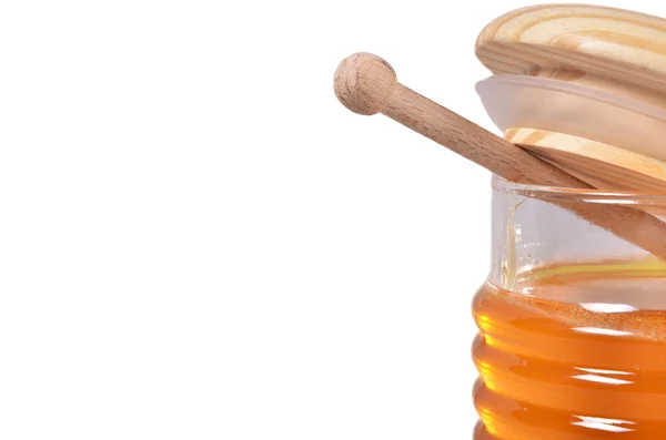 Jar of honey and stick — Stock Photo, Image