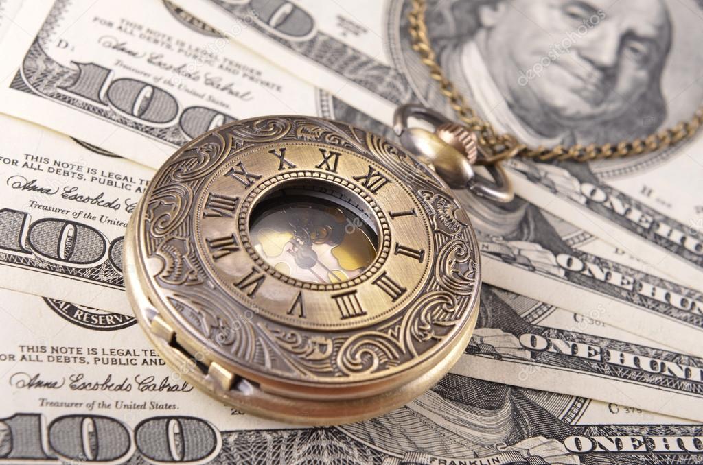 Pocket watch on money