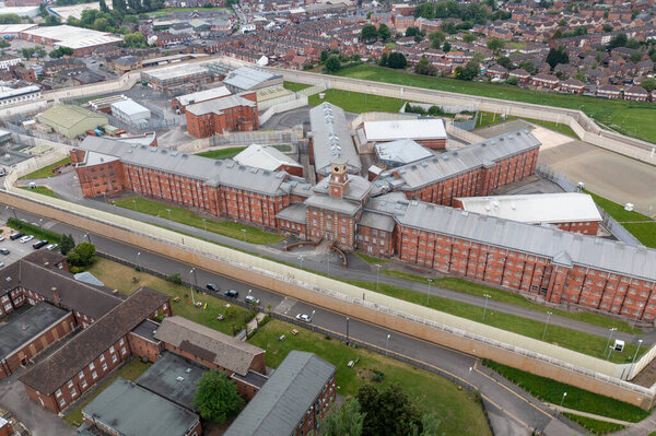 Aerial drone footage of the town centre of Wakefield in West Yorkshire in the UK showing the main building and walls of Her Majesty's Prison