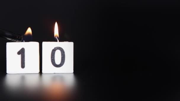 Square Candle Saying Number Being Lit Blown Out Dark Black — Stock Video