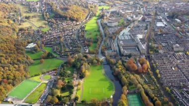 Aerial footage taken in the small town of Shipley in the City of Bradford, West Yorkshire, England showing the autumn colours of the hosing estates and roads in the town centre.