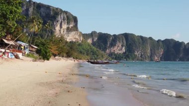 Slow motion footage of the beautiful beach of Krabi in Thailand the beach is known as AO Nang in Thailand, the slow-motion footage was taken in the morning time, with long tail boats