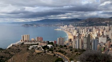 Aerial footage showing the whole of Benidorm in Alicante, you can see everywhere included Playa de Levante beach, Balcn del Mediterrneo and all the high rise hotels and golden sandy beaches.