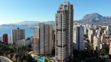 Playa Levante beach, hotels, buildings, restaurants and the coastline and sandy beaches of Benidorm and the seaside resort in Spain Alicante showing the golden sandy beaches.