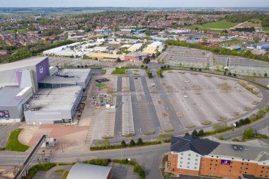 Castleford UK, 24 April 2020: Aerial photo of the Xscape Yorkshire Leisure complex in the village of Castleford in Wakefield UK showing an empty car park due to social isolation and the UK lockdown