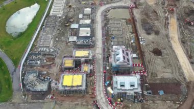 Aerial footage of a housing development site in the town of Crossgates in Leeds West Yorkshire UK, showing new housing being built on the house development construction site