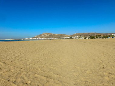Beach photo taken in Agadir in Morocco in the background you can can see the monument in the hill locally known as Agadir Oufella in the summer time.