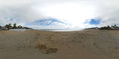 360 degree sphere panoramic photo taken in the beautiful Lanzarote in Spain one of the Canary islands showing the beach front and ocean on a sunny summers day