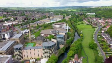 Aerial drone footage of the historic town of Shipley in the City of Bradford, West Yorkshire, England showing a Newley regenerated development of apartment buildings by the by the River Aire