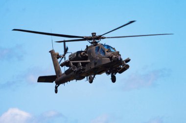 Volkel, Netherlands - June 15, 2013: Military helicopter at air base. Air force flight operation. Aviation and aircraft. Air defense. Military industry. Fly and flying. clipart