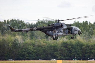 Kecskemet, Hungary - August 28, 2021: Military helicopter at air base. Air force flight transportation. Aviation and rotorcraft. Transport and airlift. Military industry. Fly and flying.