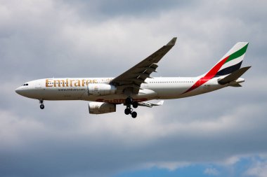 Budapest, Hungary - May 11, 2015: Emirates passenger plane at airport. Schedule flight travel. Aviation and aircraft. Air transport. Global international transportation. Fly and flying.