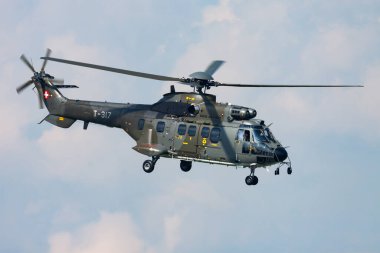 Payerne, Switzerland - September 7, 2014: Military helicopter at air base. Air force flight operation. Aviation and aircraft. Air defense. Military industry. Fly and flying.
