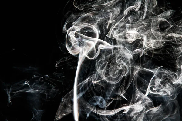 Smoke effect texture. Isolated background. Black and dark backdrop. Smokey fire and mistic effect. Spirit wave. Photo realistic mist stock image.