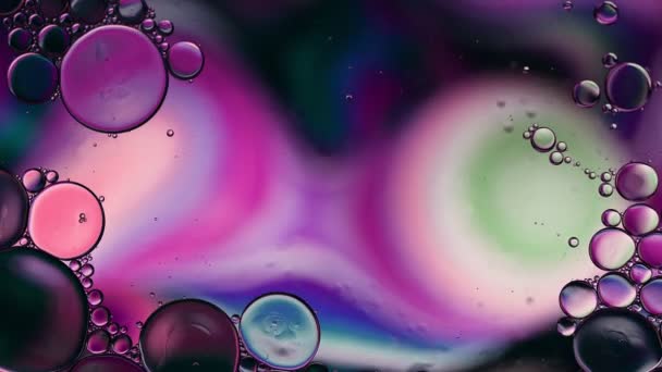 Abstract Colorful Food Oil Drops Bubbles Spheres Flowing Water Surface — Stock Video